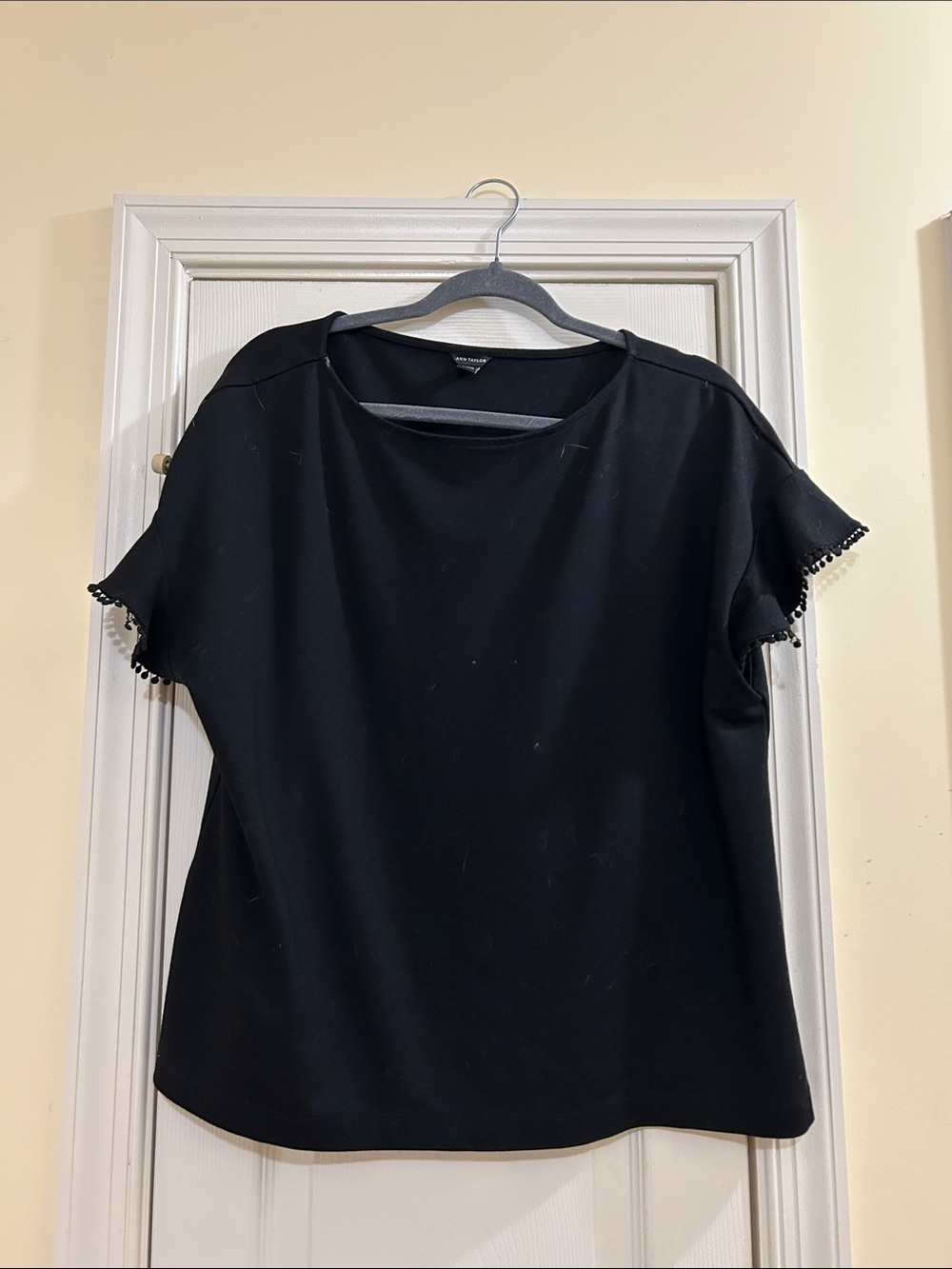 Gently worn Ann Taylor Black Short Sleeve Top with Pom Trim size XL